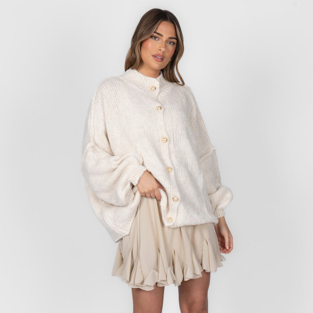 Oversized megztas kardiganas su sagomis