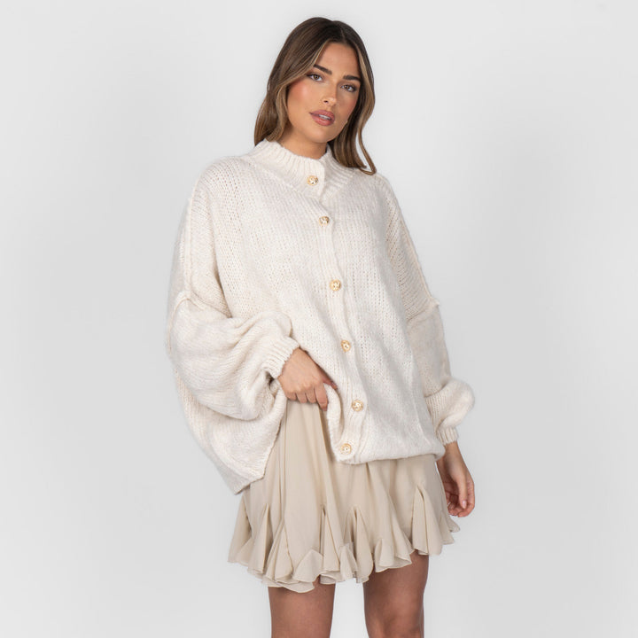 Oversized megztas kardiganas su sagomis