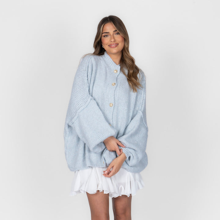Oversized megztas kardiganas su sagomis