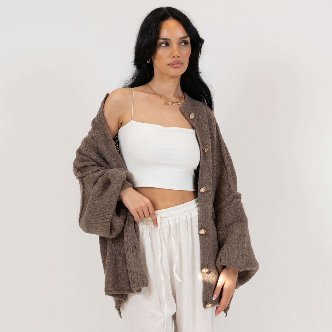 Oversized megztas kardiganas su sagomis